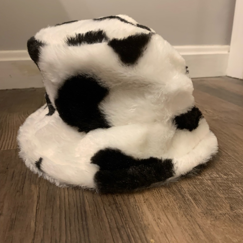 cow print bucket hat! never worn. has strings in middle to adjust size